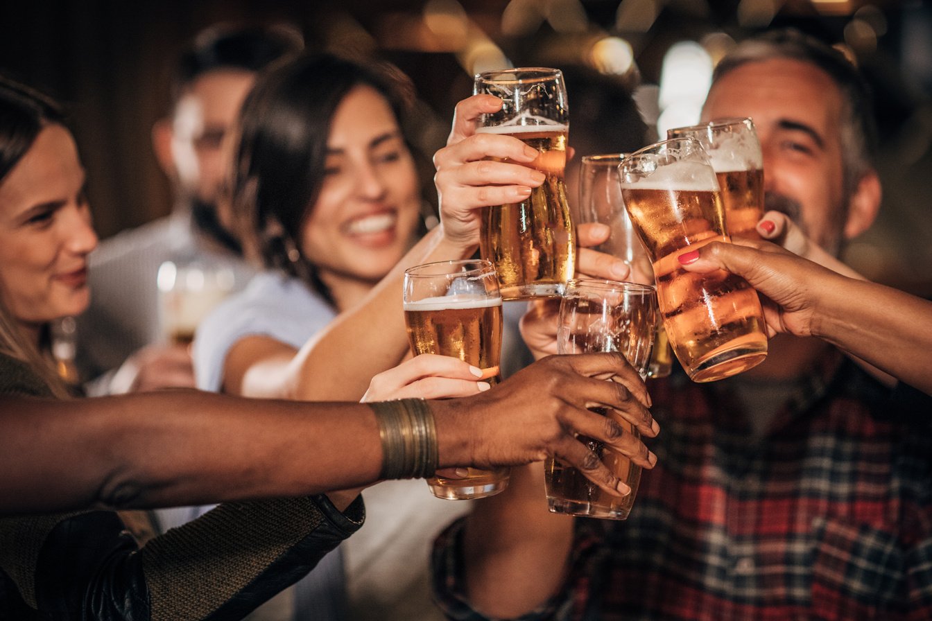 Friends drinking beer in the bar